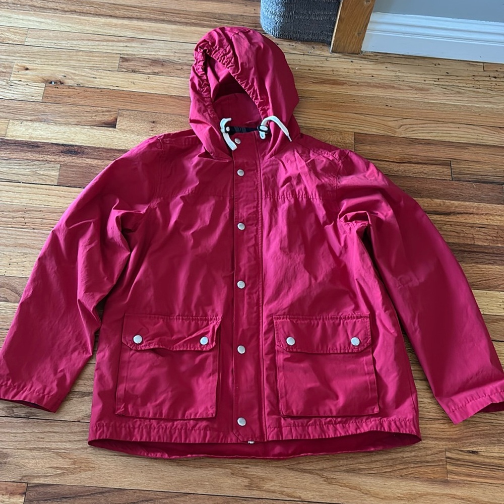 Red lined hooded raincoat with waist cyntching